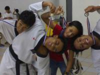 taekwondo winners - showing off their medals in taekwondo