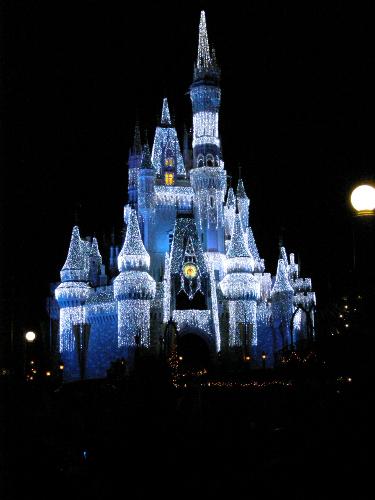 Disney Christmas Time - Cinderella's castle at night with pretty blue lights.
