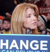 Caroline Kennedy - Caroline Kennedy behind a podium that has a Change sign in front of it.