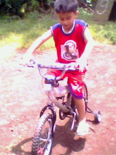 First bike! - This is my youngest son. Enjoying his first ride on his first bike. 