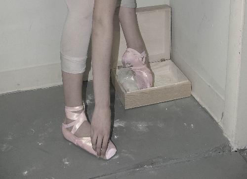 dancing - picture of ballerina getting chalk on shoes.