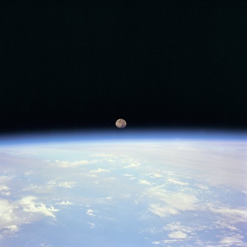 Earth's atmsphere - A photo of the moon from just above the Earth's atmosphere. What a beautiful world we live on in space.
