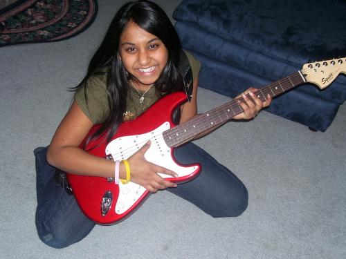Anjali with her gutar - Guitar Champion