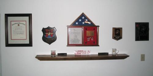 Some of My Military Mementos - This is a shot of my 'I Love Me' wall when I was living in NC. The flag shadowbox in the center was given to me at my retirement after more than 21 years of service.