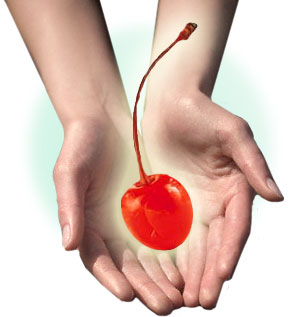 virginity - cherry held in two hands. Virginity