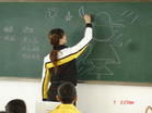 giving a lecture - The women teacher is giving a lecture to the class. Her class must be lively and interesting.