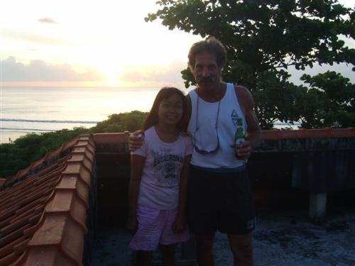 me and mr. Mink - We were standing at my favorite spot to watch the sunset. Kryssy make this picture for me. Isn't she nice? Mink likes to surf the wafe. And the roof is perfect for see all the wave at Kuta beach Bali.
