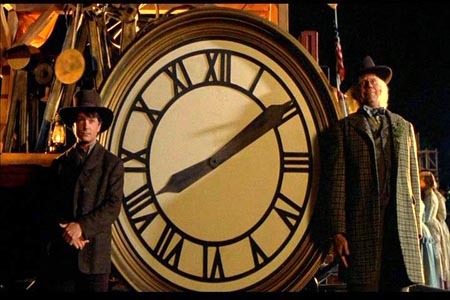 At the tower clock - This is an image of Marty and Doc in the third movie when they take a picture with the tower clock back in time when it wasnt even built