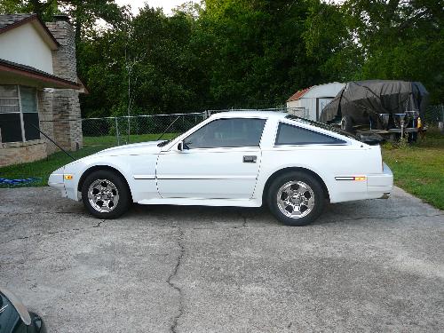 1986 Nissan 300ZX - This is my hardtop Z and her name is Alice. She has had one owner and she had less than 120,000 miles when I bought her 3 years ago. The rims are not original, but other than that she is stock and was in mint condition. I say 'was', because my mother crumpled the front quarter panel about three months after I bought her. I love these cars, they are so comfortable and fun to drive. My only complaint is no cup holders...but I think I can deal!