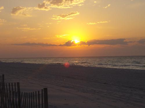 Florida Sunrise - On a chilly February morning at Pensacola Beach, this was taken. The beach is most beautiful in that hour before dawn... not a soul lines the beach, when typically the sand is lined with bodies. But no, not now. You are all alone to enjoy the beauty God has to offer. It's a majestic process, really. How the sun wrestles with the clouds, creating such glorious sights.
