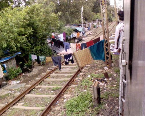 clothes dryer across the line - here we see a clothes-line hung across railway tracks!!! India is great!