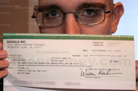 a person showin his adsense check...he receivd it  - have a close look at the cheque amount...u may be fainting..its running into millions..