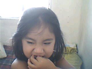 A child in her naughty mood - Making face when naughty. A child in her naughty mood.