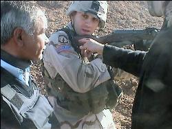 The War Tapes - Sgt. Zack Bazzi trains an Iraqi policeman in a scene from The War Tapes.  
SenArt Films/Scranton/Lacy Films