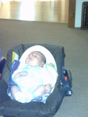 Justin taken by GG Mary - Justin asleep in his carseet at Uncle Jimmy's and Aunt Cassie's