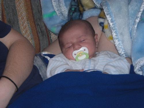 Justin taken by GG Mary - Justin asleep on mommy's lap at Uncle Jimmy's and Aunt Cassie's
