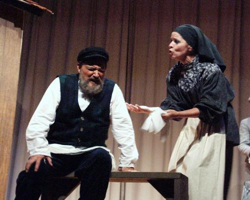 Tevye: Please! Can't you see I have a hangover? - Tevye had been drinking the night before trying to find a good husband for his daughter.