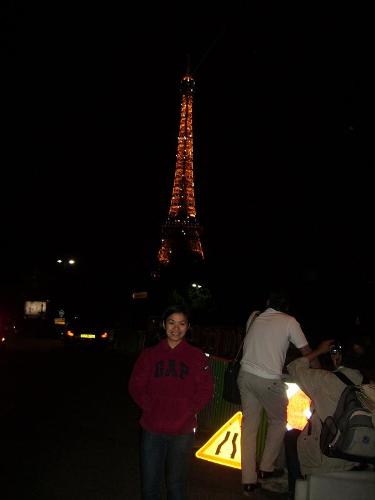Nigh time in Paris beside the Eiffel Tower - People still sight seeing during night time in Paris at the Eiffel Tower.
