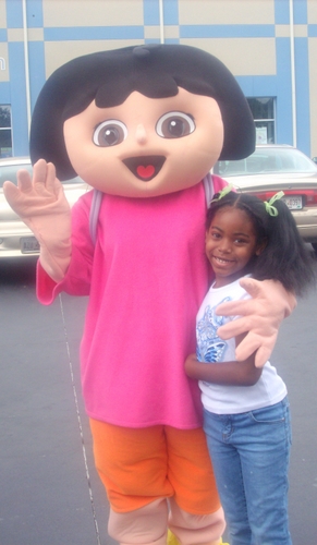 Miss'T'& Dora - This is my youngest sister and Dora the Explorer at a career Expo that my family went to. Lets just say that she was overly excited to be next to her favorite character off the hit Nickeloden Show.