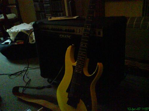Ibanez RG - My prized possession, my yellow Ibanez RG with Crate amp