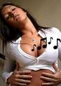 music to my ears - Picture of a latino women in white shirt cut off below her breast with hands on her stomach and music notes crossing over her and he head tilted back and to the side in pleasure