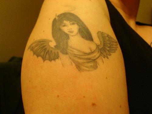 tattoo - my Dom drew this tattoo...it is me lol half angel/half deviless