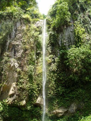 Camiguin - Katibawasan Falls.  A beautiful, clear stream of water cascading 70 meters into a rock pool surrounded by gound orchids, wild ferns, trees and boulders. It's cold water provided a refreshing summer splash to all bathers