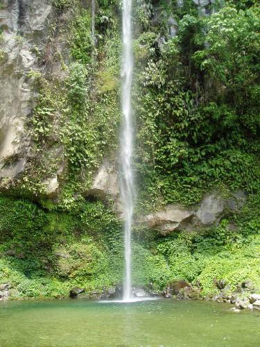 Camiguin - The approach to the wild and might falls entails a very scenic hike passing through the quaint Barrio of Mainint, Catarman and along the rockly river bed. The surrounding scenery is virgin and perfect for a peaceful picnic. The only sound you head is that of the tumbling falls and running water. It is 6 kilometers northwest of Catarman proper.