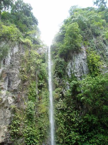 Camiguin - Katibawasan Falls  A beautiful, clear stream of water cascading 70 meters into a rock pool sorrounded by ground orchids, wild ferns, tress and boulders. Its cold water provided a refreshing summer splash to all bathers.
