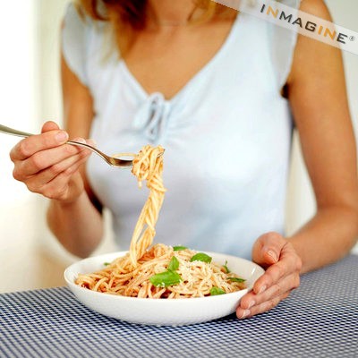 pasta - woman eating pasta.