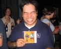 something to be happy about - Picture of a guy with wide cheesy smile and eyes squeezed closed with a greeting card in front of him