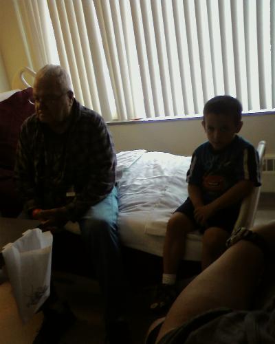 Maverick and his Papa - Papa is in a physical rehab center after a stroke and we went to visit him.
