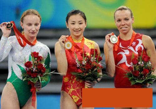 chinese beauty wins a gold medal in the 2008 olymp - look at her smiling eyes
