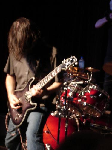 playing a show - Picture taken from the last show I played with Of The First Born Son (www.myspace.com/otfbs) Check out the new project www.myspace.com/metalmementomori