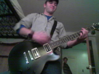 Nezzy and I - This is picture of Nezzy and I not long after I bought her. Nezzy is a Ibanez Artist Series with a black matte finish.