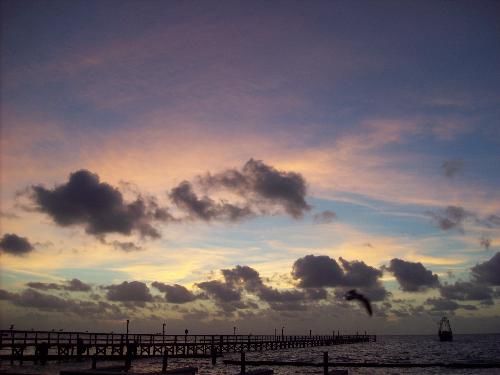 Sunset at the coast - I love taking pictures of sunrises and sunsets. This is a picture of a beautiful sunrise I took on the way to the coast. I just love it when you get so many beautiful colors blending in the sky. Rockport Texas 2008