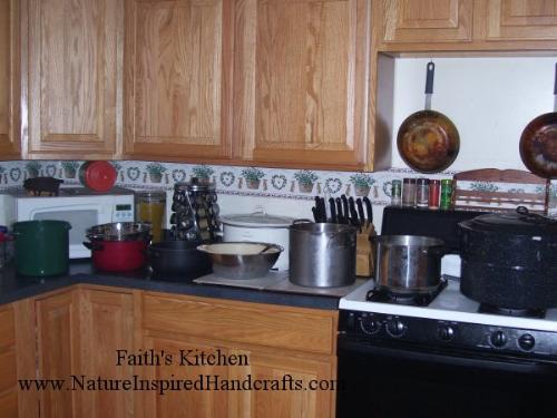Faith's Kitchen - This photo shows my production line process of canning stewed tomatoes grown in my Michigan garden