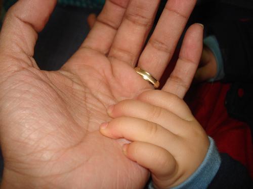 parenting - mother and baby holding hands