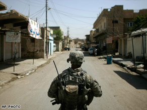 US soldier patrols stree in Iraq. - When will they come home? US soldier patrols stree in Iraq. - When will they come home?