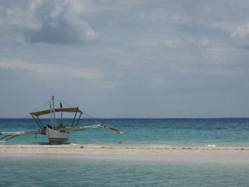 motor boat used for island hopping - island hopping is a fun activity. you spend time with friends and get closer to mother nature. in the picture is a motor boat, that what we usually use to travel from one island to another, well it's actually big than on the picture. this picture is in bantayan island that's in cebu philippines.