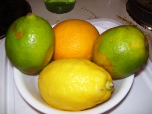 A bowl of citrus fruit - This bowl has two limes one lemon and one orange. I like citrus fruit, it is very refreshing in the summer.