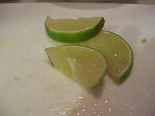 Lime slices - Three slices of lime. They have a green rind and a light green flesh inside. They are tangy, some people use a sweetener and make limeade, some like cherry limeade. I like lime in ice water or tea, as well.