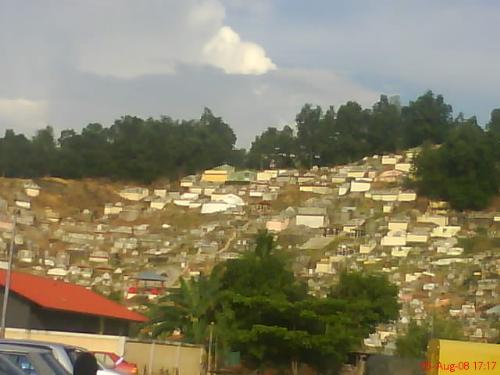 The Grave in Kian Kok, Likas Sabah. - What a scary place but people live here get used of this place. Sometimes, kids eat and play on the top of the grave!