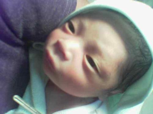 cute! my first baby patient! - this was my first struggle as a nursing student. bathing and dressing the new born. how lovely! :))