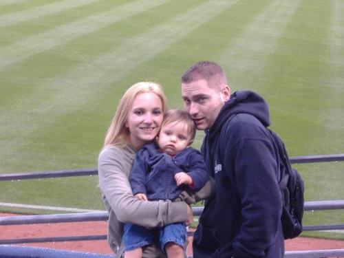 My nephew, brother, and SIL at a baseball game - My brother and his wife share their baby's first baseball game