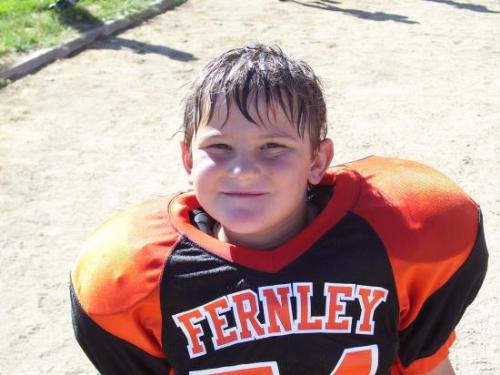 My seven year old after his first football game - My 7 year old after his first football game.