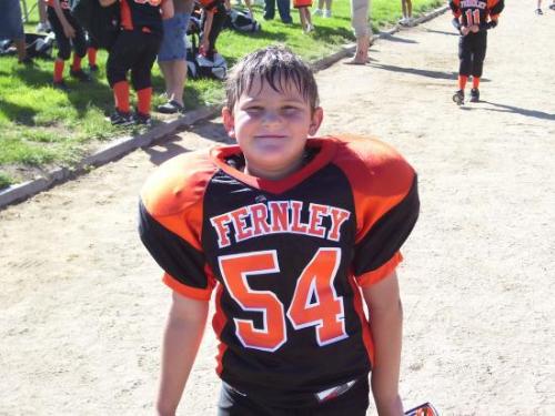 My 7 year old after his first football game this s - My 7 year old after his first football game this summer
