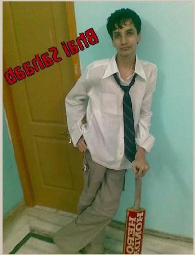 A Cool Student - A photo of a cool student wearing a loose tie on a white T-Shirt with Beige pants. His hair is not combed and is standing with a cricket bat. In today's world, having such an appearance is termed as 'Cool'.