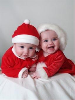 xmas kids - the two babies are very cute and smiles at us joining their soft hands.. really a nice pic isn't it
