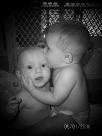 baby kissing - the care can be expressed in a better way through a lovely kiss.. this pic portrays it